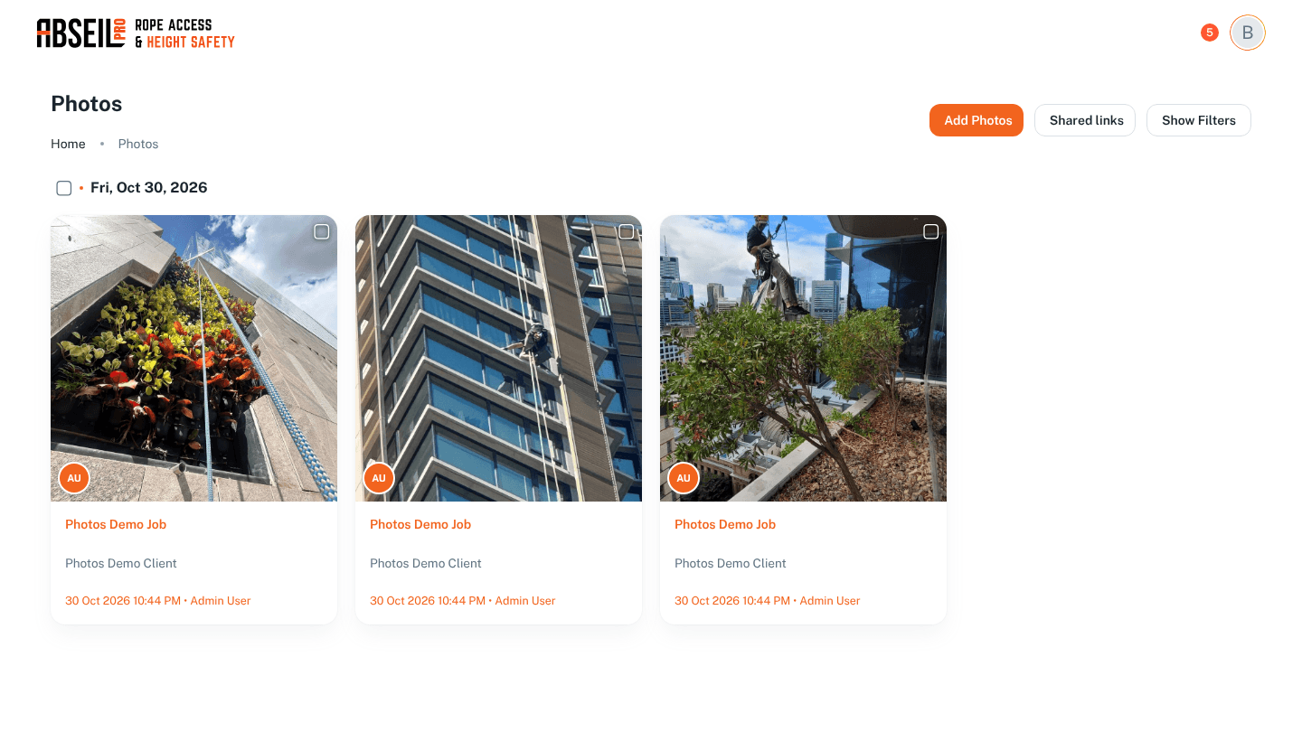 The Ropr photos page on a laptop, with job photos grouped by day